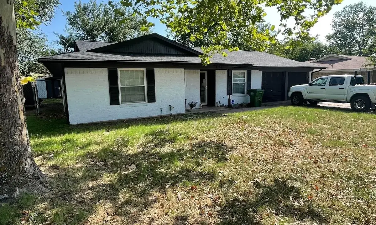 Professional roofing crew working on a residential roof in Arbutus